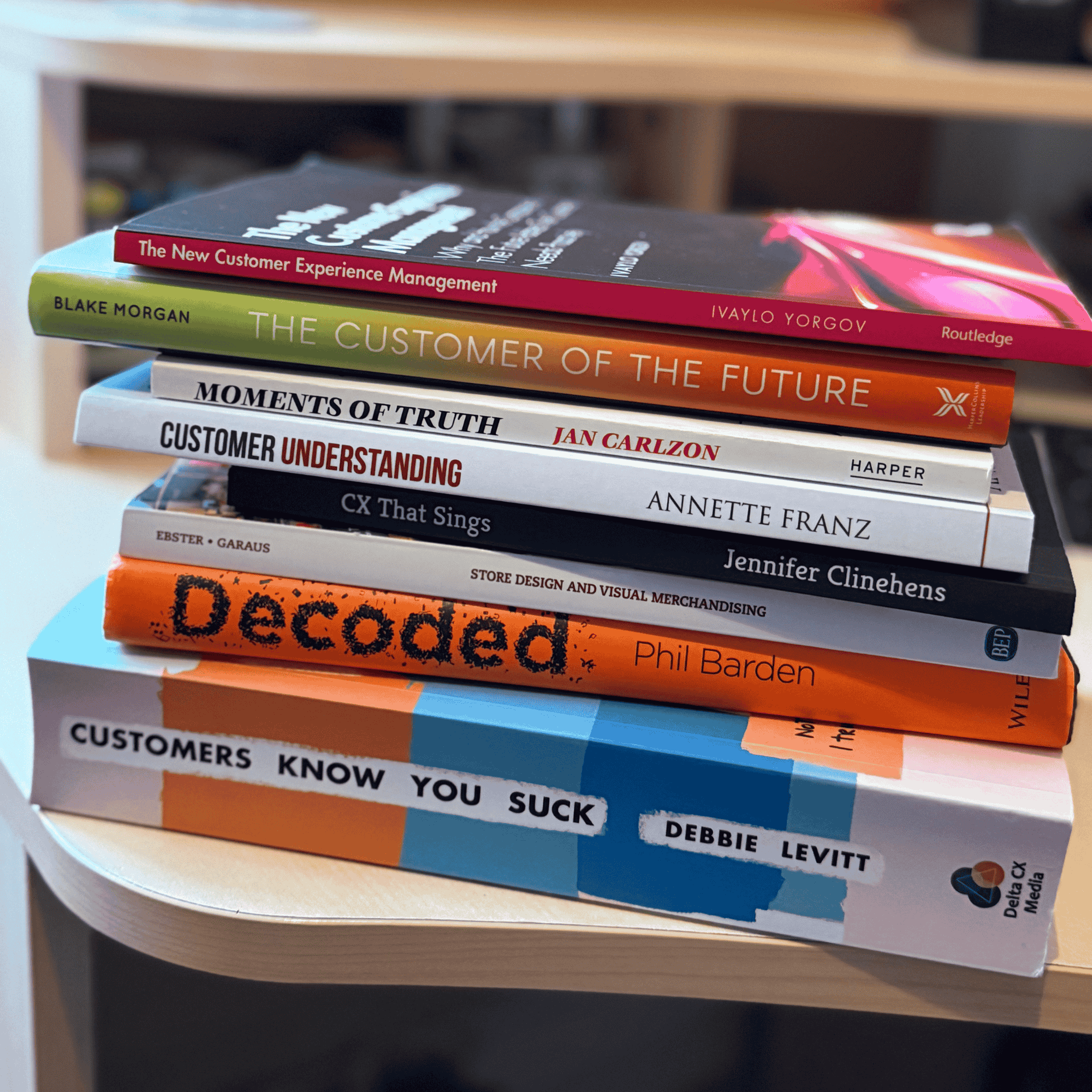 Stack of customer experience books